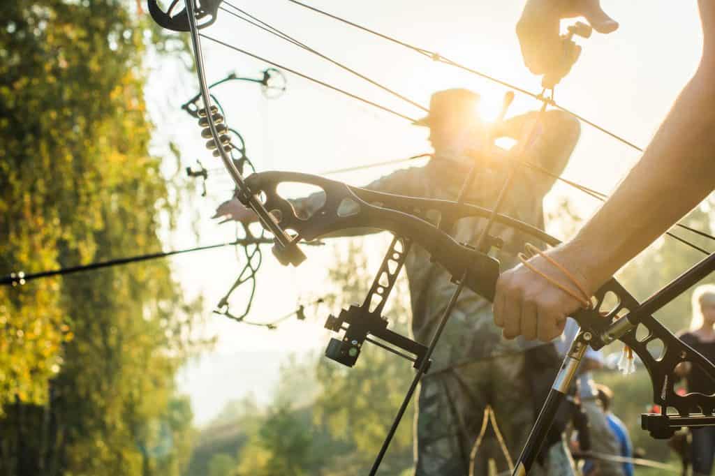 people hunting with bows